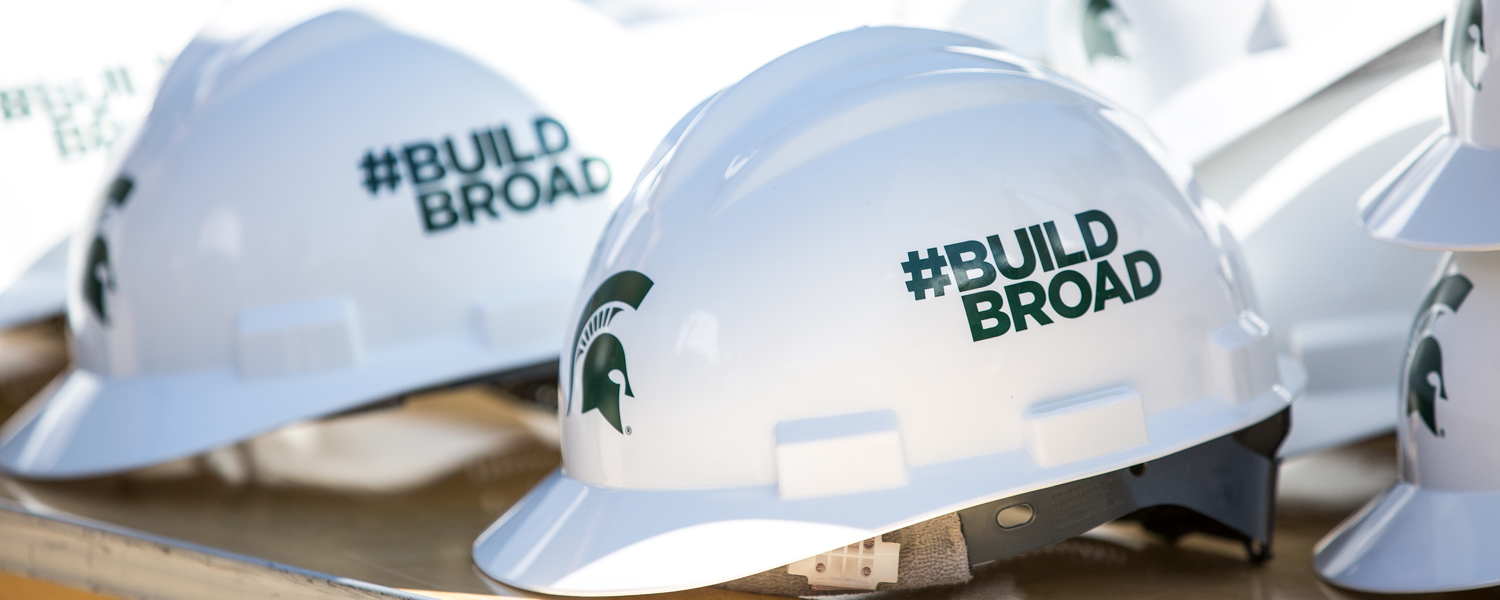 Hard hats with #BuildBroad printed on side